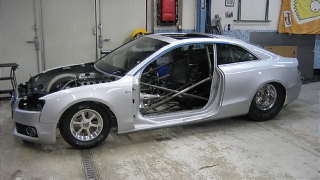 Illustration for article titled Watch an Audi A5 transform into a drag car
